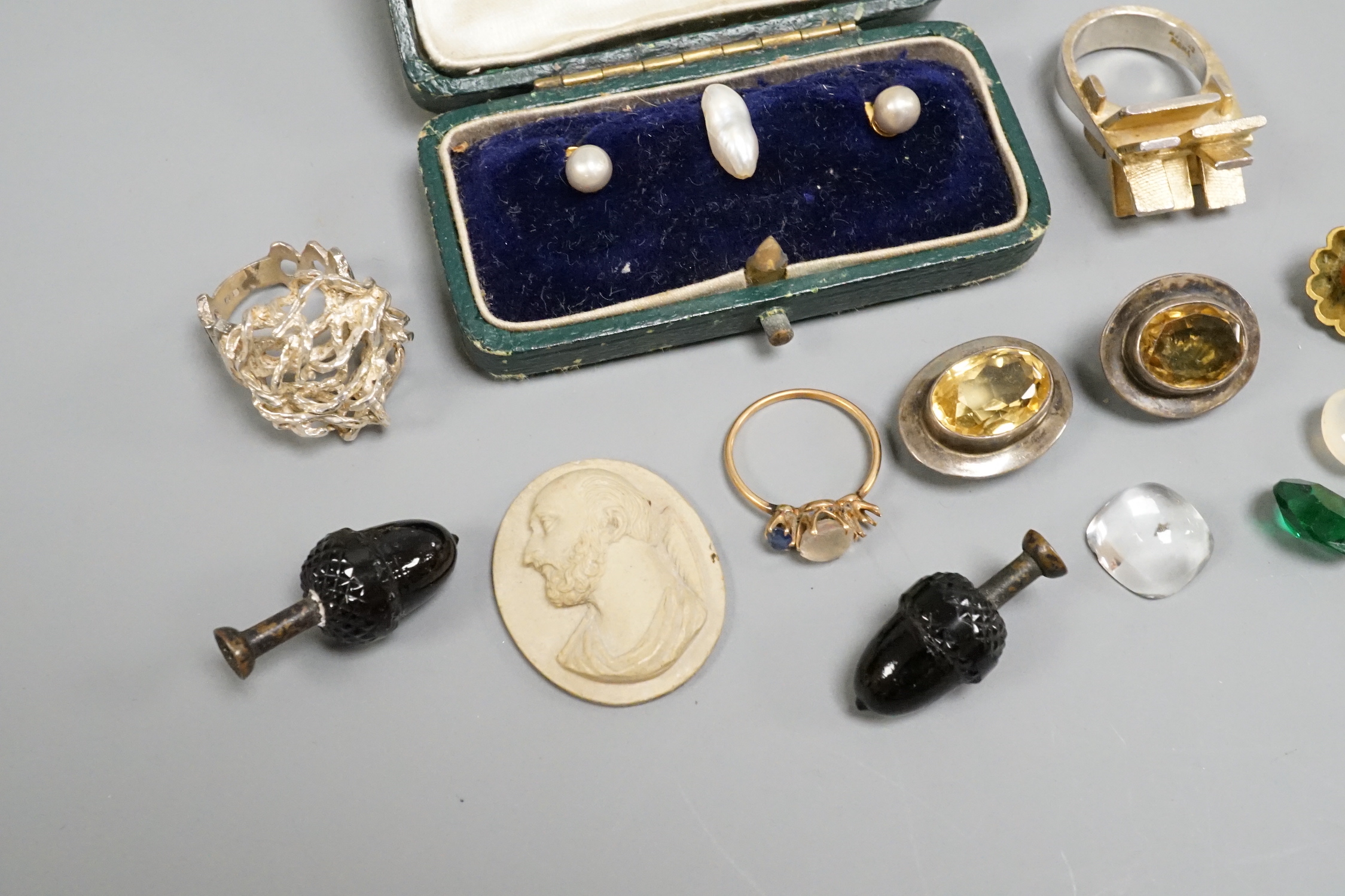 A small group of jewellery and curios including a Scandinavian sterling modernist ring, one other white metal modern ring, a lava cameo dress stud set etc.